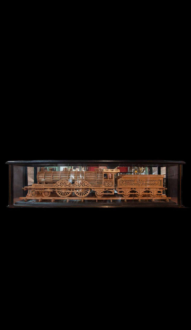 Carved Wood Model of a Locomotive in Black Lacquered and Glass Case