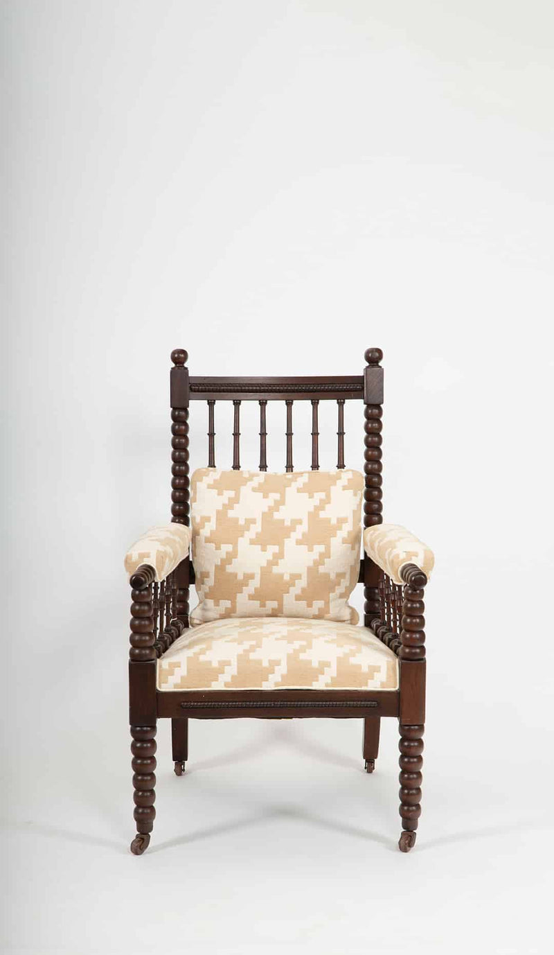 A Victorian Bobbin-Turned Armchair in Carved Oak