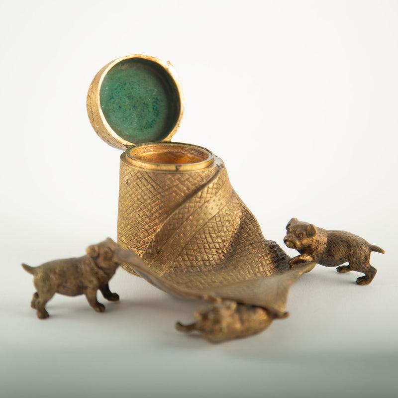 Tug of War: A Bronze Inkwell of Tugging Pugs on a Rug