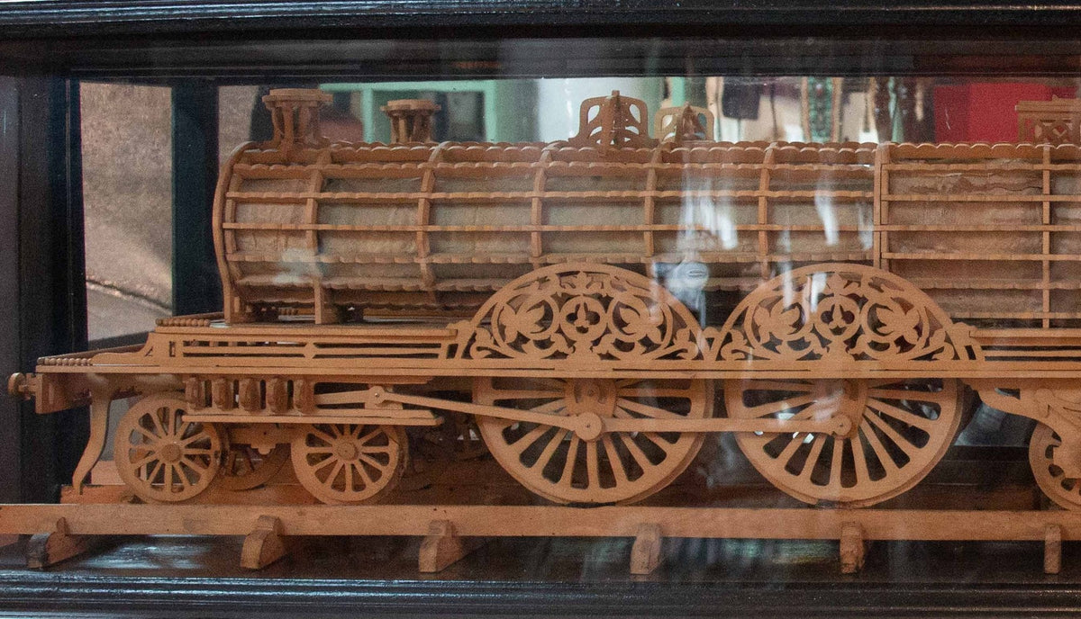 Carved Wood Model of a Locomotive in Black Lacquered and Glass Case